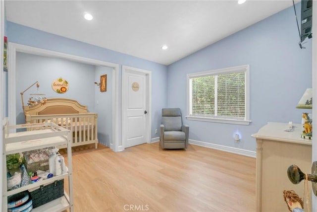bedroom with recessed lighting, light wood finished floors, vaulted ceiling, and baseboards