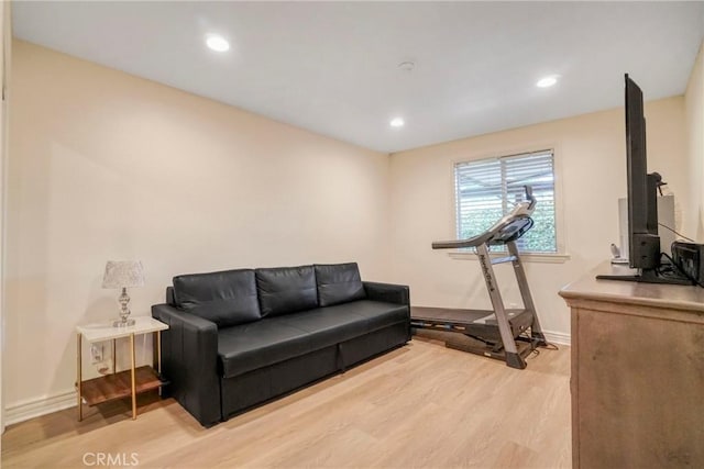 interior space with light wood finished floors, baseboards, and recessed lighting