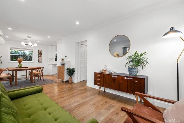 2410 Exposition Pl, Los Angeles, CA 90018 - living area with a chandelier, light wood-type flooring, crown molding, and recessed lighting