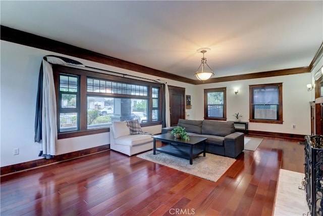 living room featuring baseboards and wood finished floors