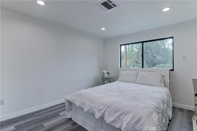 bedroom featuring baseboards, dark wood-style flooring, recessed lighting, and visible vents