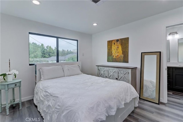 bedroom with recessed lighting, baseboards, visible vents, and wood finished floors