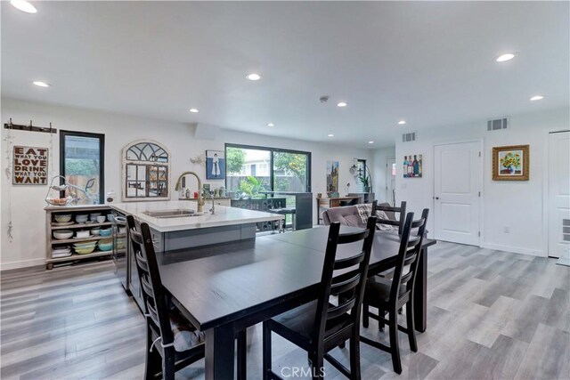dining room featuring recessed lighting, visible vents, and light wood-style floors