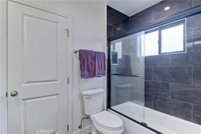 223 N St Andrews Pl, Los Angeles, CA 90004 - bathroom featuring toilet and shower / bath combination with glass door