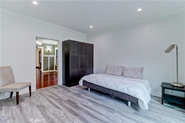 bedroom with recessed lighting, baseboards, ornamental molding, and light wood-type flooring