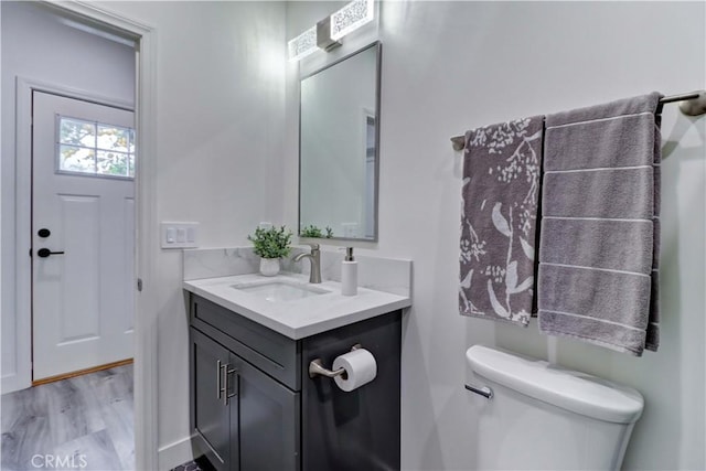 half bath with vanity and toilet