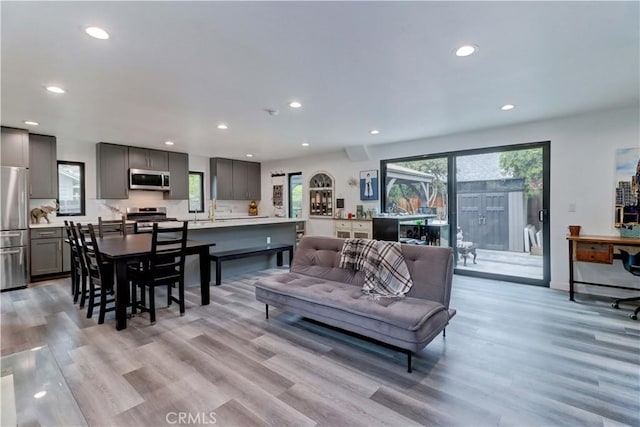 living room featuring recessed lighting and light wood-style floors