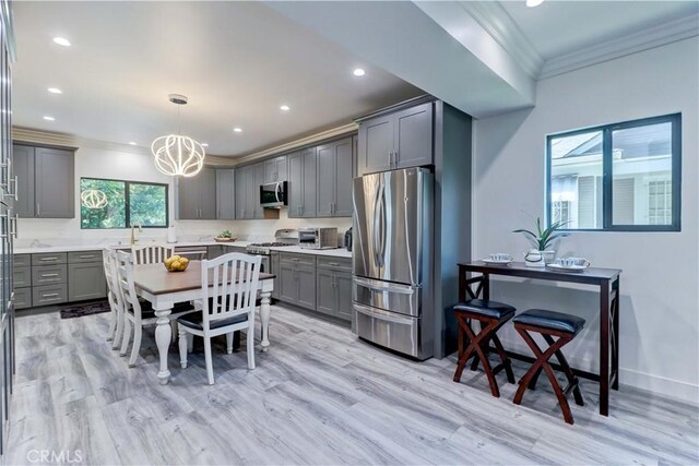 223 N St Andrews Pl, Los Angeles, CA 90004 - kitchen featuring stainless steel appliances, ornamental molding, gray cabinetry, light countertops, and recessed lighting
