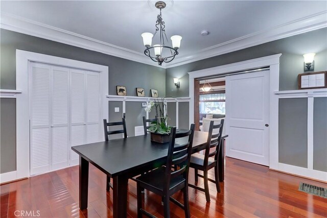 223 N St Andrews Pl, Los Angeles, CA 90004 - dining area with a chandelier, wood finished floors, and crown molding