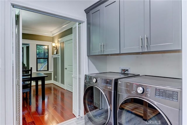223 N St Andrews Pl, Los Angeles, CA 90004 - washroom with cabinet space, separate washer and dryer, crown molding, and dark wood-style floors