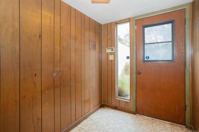 557 Canyon Dr, Solana Beach, CA 92075 - entryway with wooden walls, light floors, and baseboards