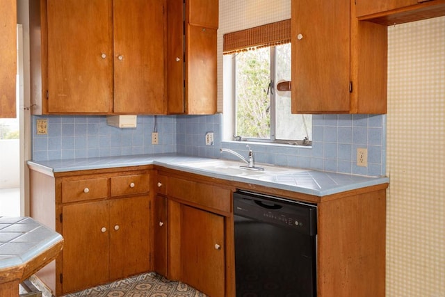 557 Canyon Dr, Solana Beach, CA 92075 - kitchen with black dishwasher, tile counters, a sink, decorative backsplash, and brown cabinets