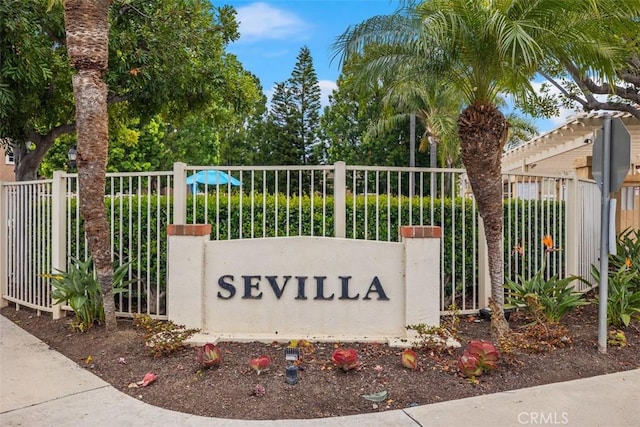 community / neighborhood sign with fence