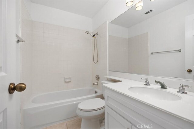 bathroom featuring shower / bathing tub combination, visible vents, tile patterned floors, vanity, and toilet