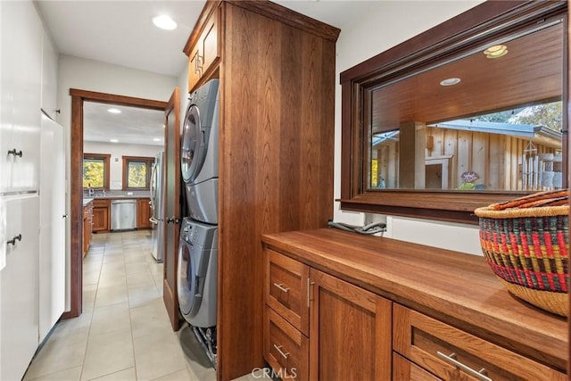 12352 Centerville Rd, Chico, CA 95928 - laundry area featuring stacked washer / dryer, light tile patterned flooring, and recessed lighting