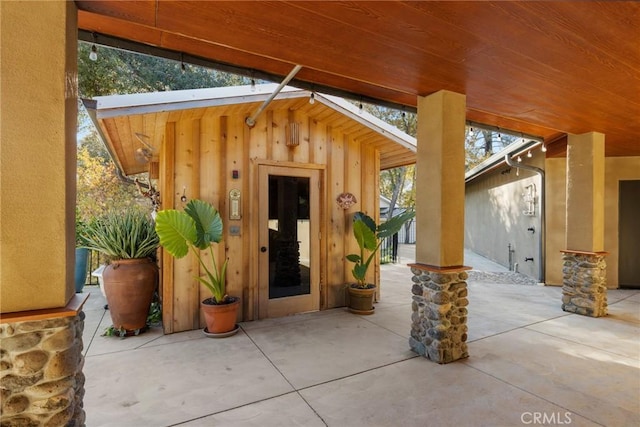 12352 Centerville Rd, Chico, CA 95928 - view of exterior entry featuring a patio area and board and batten siding