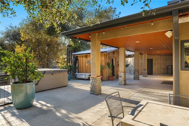 12352 Centerville Rd, Chico, CA 95928 - view of patio / terrace with a hot tub and an outbuilding