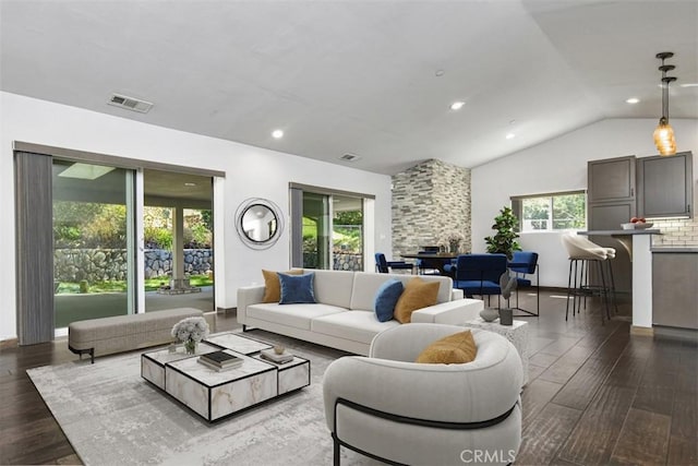 2447 Stonyvale Rd, Tujunga, CA 91042 - living area with wood finished floors, vaulted ceiling, and recessed lighting