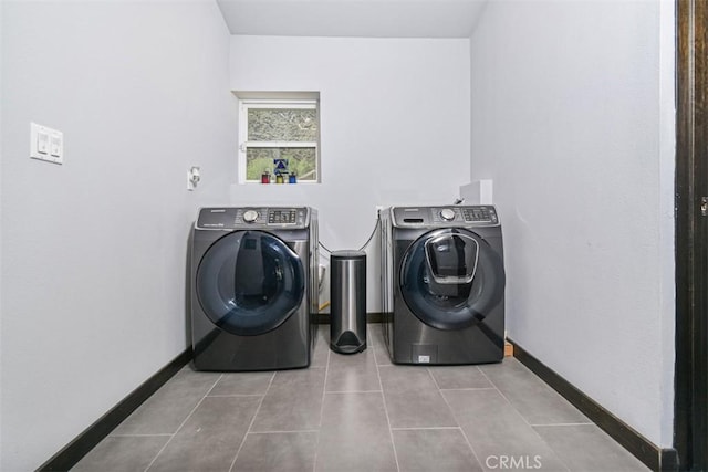 2447 Stonyvale Rd, Tujunga, CA 91042 - washroom featuring washing machine and clothes dryer and tile patterned flooring