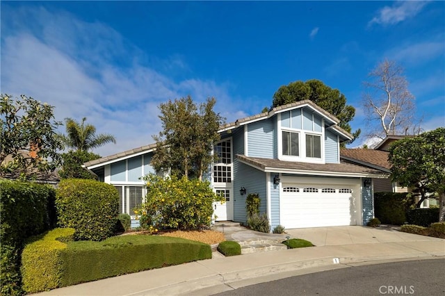 1 Champlain, Irvine, CA 92620 - view of front facade with a garage and driveway
