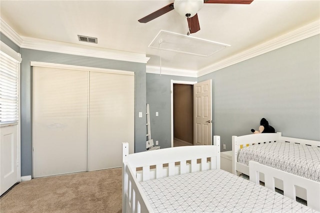 27596 N Bay Rd, Lake Arrowhead, CA 92352 - bedroom with attic access, ornamental molding, carpet, a closet, and ceiling fan
