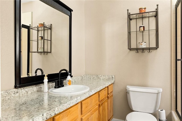 27596 N Bay Rd, Lake Arrowhead, CA 92352 - bathroom featuring toilet, vanity, and a shower with shower door