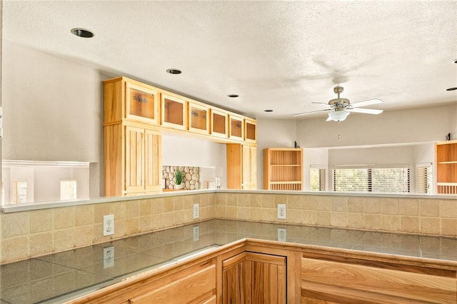 27596 N Bay Rd, Lake Arrowhead, CA 92352 - kitchen with backsplash, a ceiling fan, glass insert cabinets, and recessed lighting