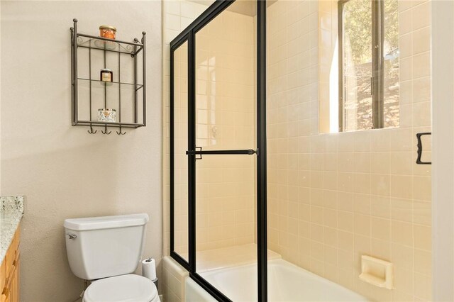 27596 N Bay Rd, Lake Arrowhead, CA 92352 - full bathroom featuring toilet, bath / shower combo with glass door, and vanity