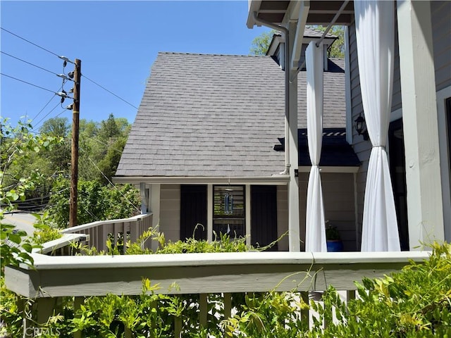 27596 N Bay Rd, Lake Arrowhead, CA 92352 - view of property exterior with a balcony and roof with shingles