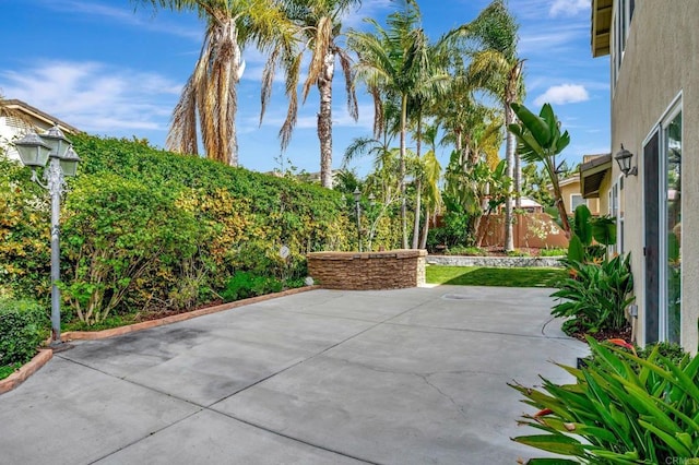 view of patio featuring fence
