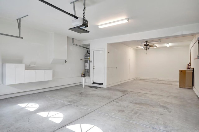 garage with water heater and a garage door opener