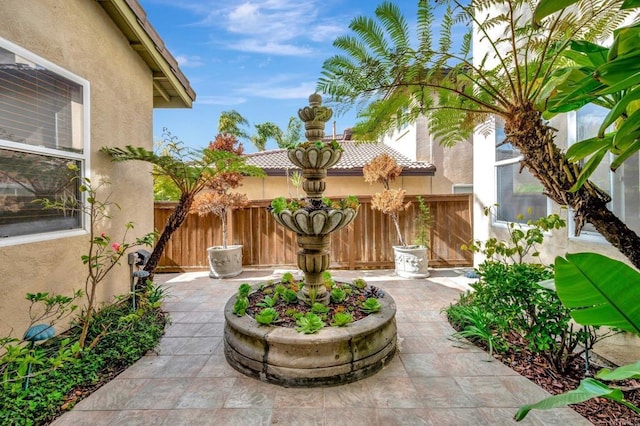 view of patio / terrace featuring fence