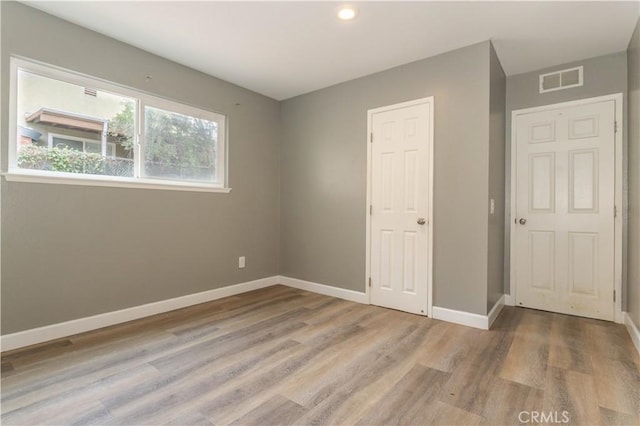 28414 Winterdale Dr, Canyon Country, CA 91387 - unfurnished bedroom with recessed lighting, light wood-type flooring, visible vents, and baseboards