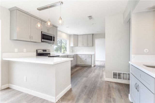 28414 Winterdale Dr, Canyon Country, CA 91387 - kitchen with visible vents, appliances with stainless steel finishes, baseboards, and gray cabinetry