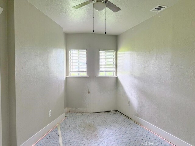 47409 Thunderhill Ln, Squaw Valley, CA 93675 - empty room featuring ceiling fan, a textured wall, a textured ceiling, and light floors
