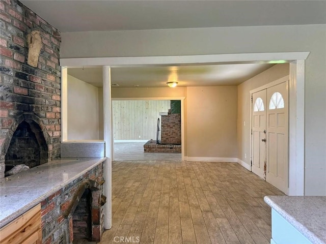 47409 Thunderhill Ln, Squaw Valley, CA 93675 - foyer entrance with light wood-style floors and a wood stove