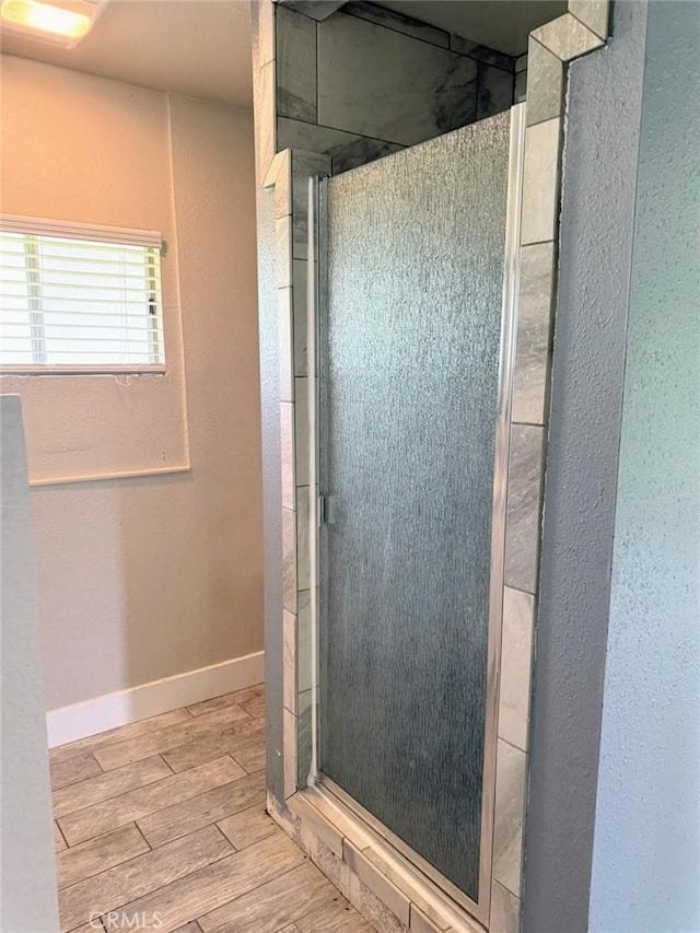 47409 Thunderhill Ln, Squaw Valley, CA 93675 - bathroom featuring wood finished floors, a shower stall, and a textured wall