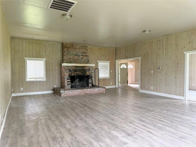 47409 Thunderhill Ln, Squaw Valley, CA 93675 - unfurnished living room with wood finished floors, a fireplace, and wooden walls
