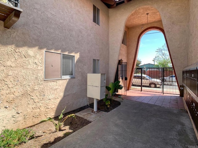 438 S Anza St, El Cajon, CA 92020 - exterior space with stucco siding, fence, and a gate