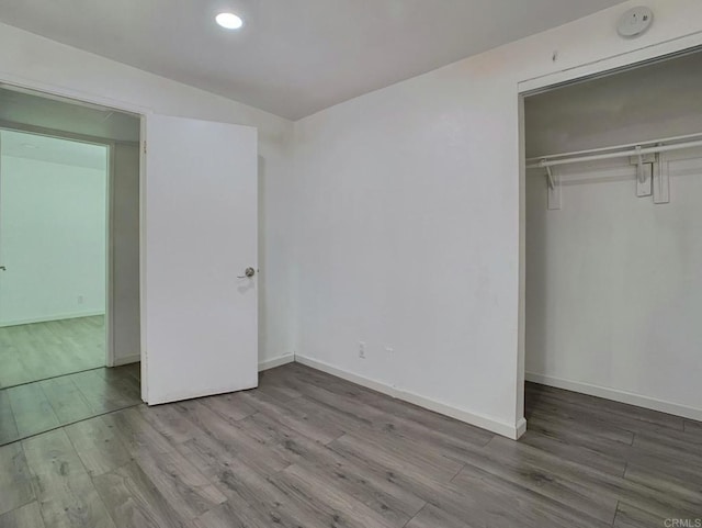 438 S Anza St, El Cajon, CA 92020 - unfurnished bedroom with wood finished floors, a closet, recessed lighting, and baseboards