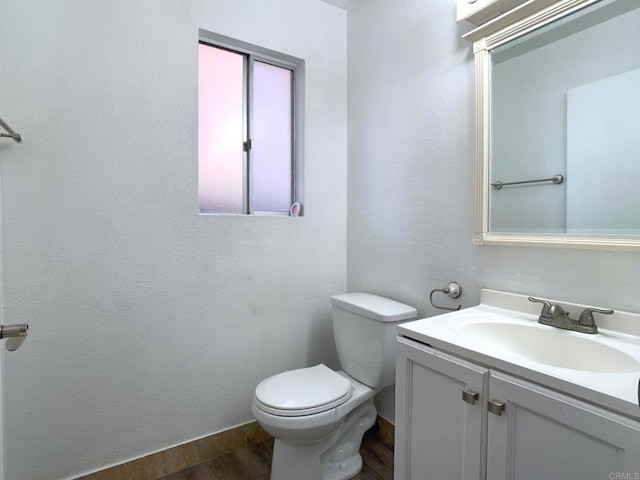 438 S Anza St, El Cajon, CA 92020 - bathroom with toilet, vanity, and wood finished floors