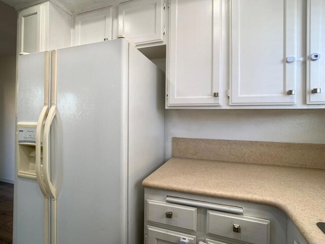 438 S Anza St, El Cajon, CA 92020 - kitchen featuring white refrigerator with ice dispenser, white cabinets, and light countertops
