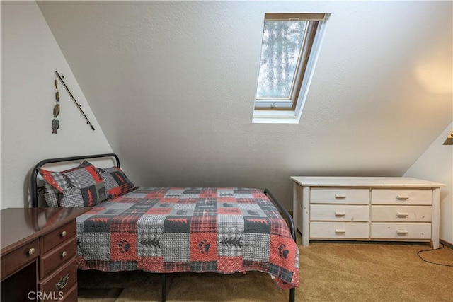 bedroom featuring carpet flooring and a skylight