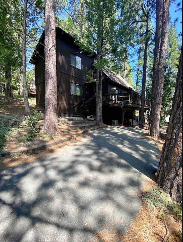 view of side of home featuring a deck