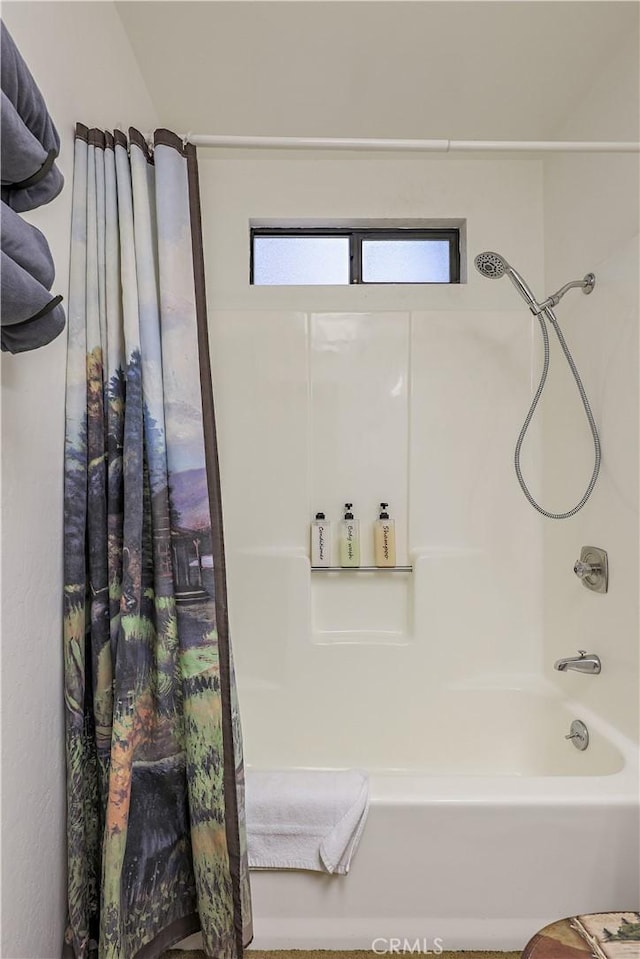 bathroom featuring shower / bath combination with curtain