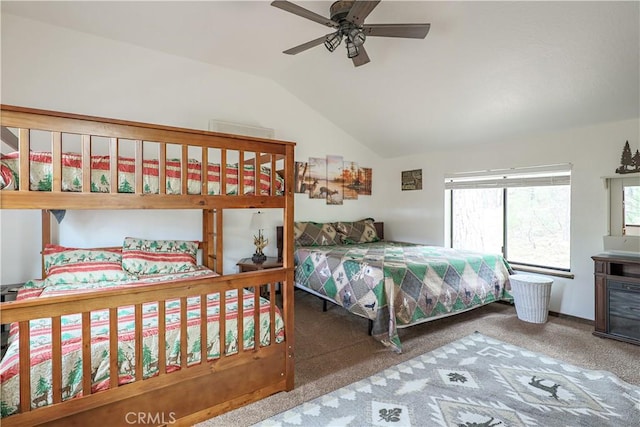 carpeted bedroom featuring vaulted ceiling and ceiling fan