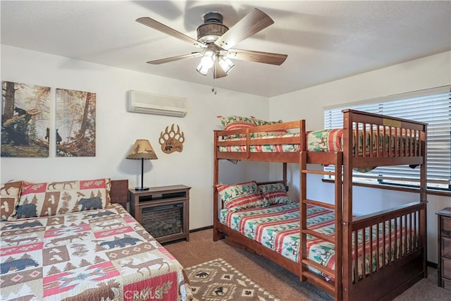 bedroom with carpet flooring, a ceiling fan, and a wall mounted air conditioner
