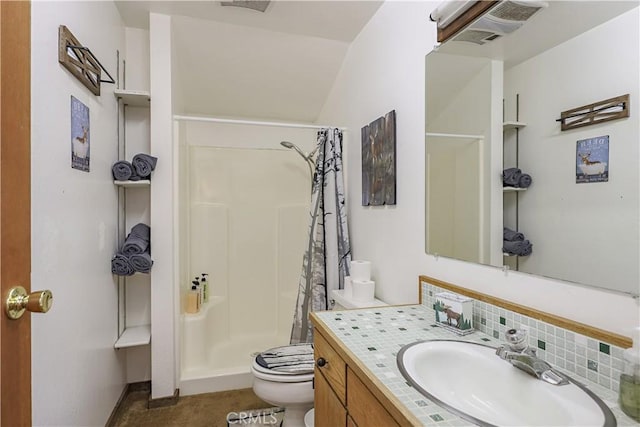 bathroom with a stall shower, toilet, vanity, tasteful backsplash, and visible vents