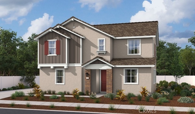 view of front facade with stucco siding and fence