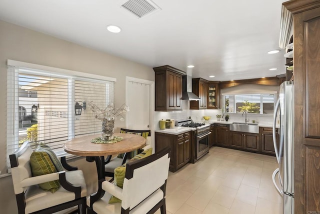 2422 Chatsworth Blvd, Point Loma, CA 92106 - kitchen featuring light countertops, a sink, wall chimney exhaust hood, stainless steel appliances, and visible vents